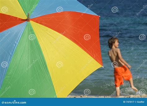beach fun stock image image  umbrella parasol child