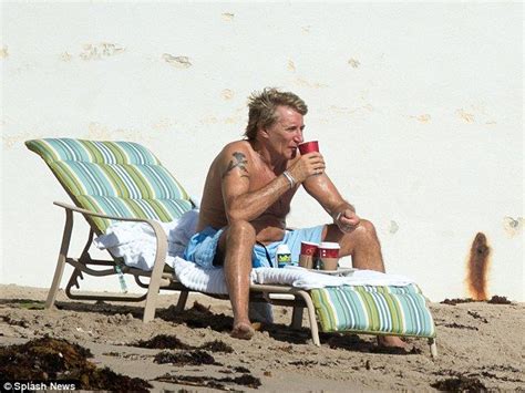 Rod Stewart Tops Up His Tan As He Watches Wife And Son