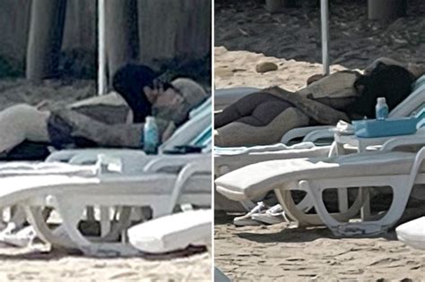 kourtney kardashian and travis barker kiss and cuddle on beach in santa