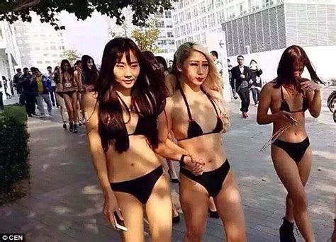 chinese marketing firm sticks barcodes on the buttocks of models to promote new app daily mail