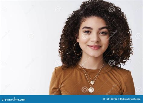 stylish good looking happy carefree dark curly haired girl smiling