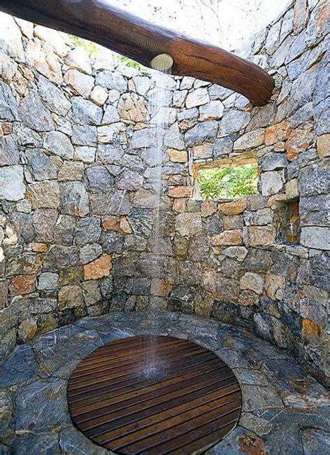 outdoor shower design ideas showing beautiful tiled  stone walls