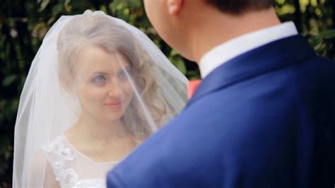 groom lifting veil off beaming brides face stock footage sbv 304707094