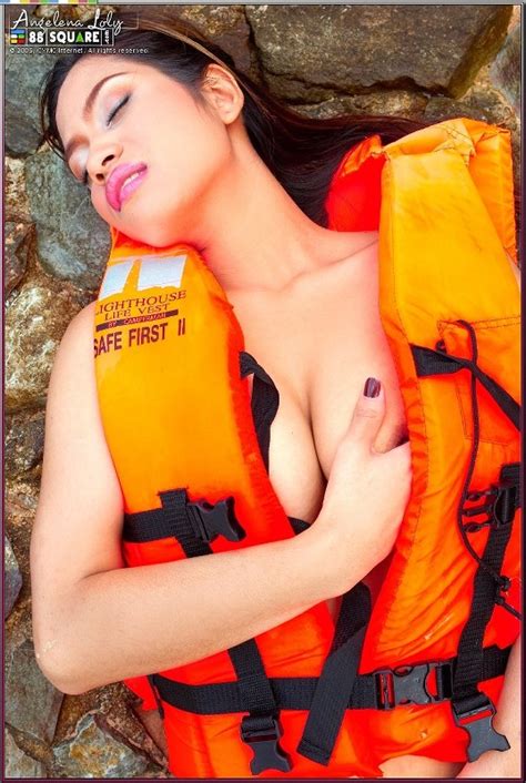 beautiful asian babe wearing a life jacket and showing her horny poses asian porn movies