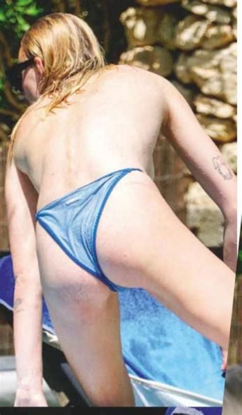 sophie turner topless sunbathing poolside taxi driver movie