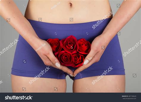 intimate part   womans body  roses stock photo