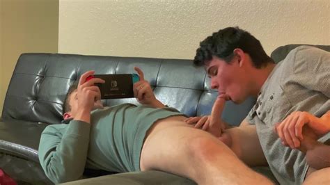 jock lets teen twink suck and ride while he games