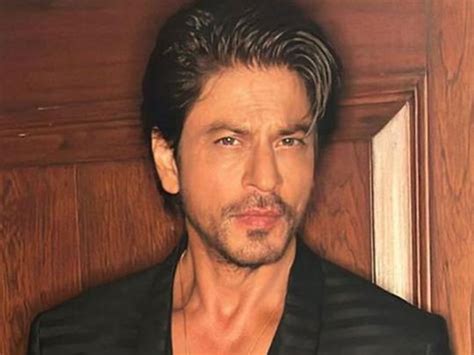 bollywood star shah rukh khan looks dapper in black suit for ambani