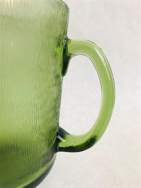 vintage green glass pitcher vintage textured pitcher green etsy