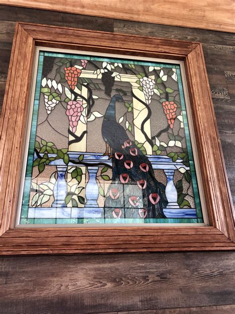 beautiful stained glass peacock windows installed