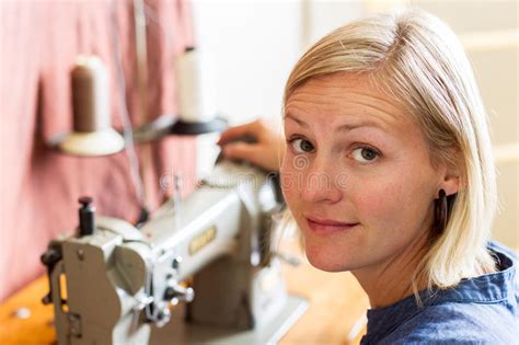 pretty blonde woman at sewing machine stock image image of machine