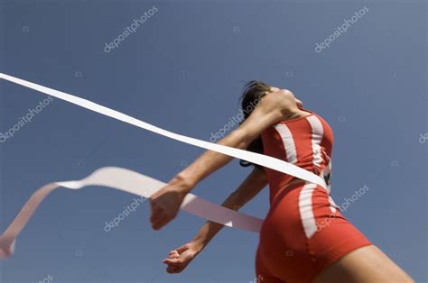 athlete crossing finish  stock photo  clondondeposit