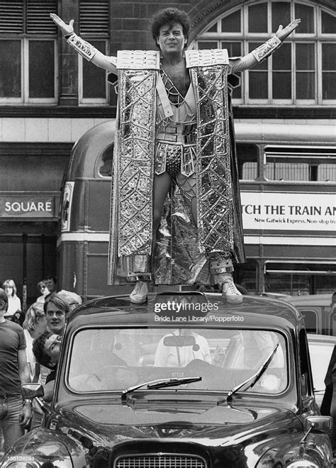 English Pop Singer Gary Glitter Posing On The Roof Of A Taxi To
