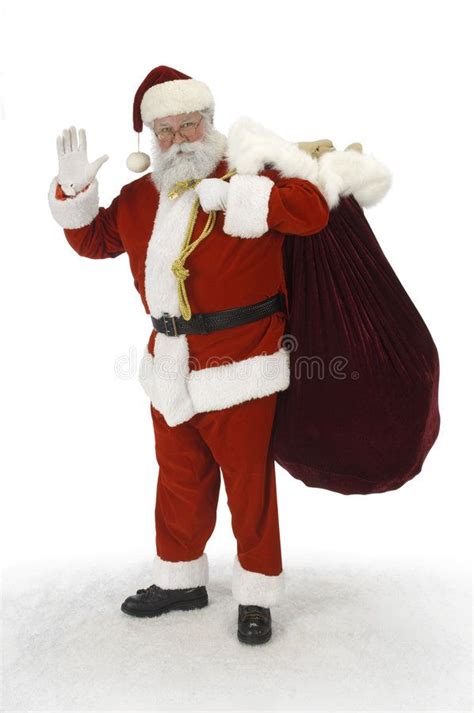 man dressed  santa claus waves   camera  holding  bag