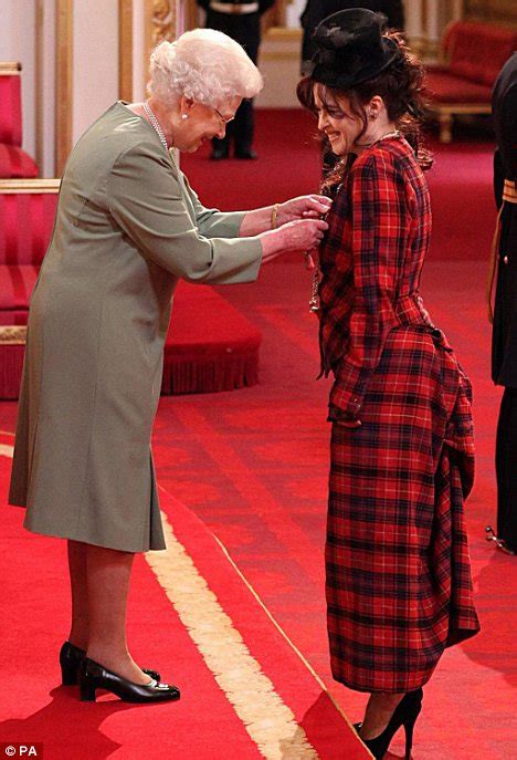 helena bonham carter picks up a cbe from her daughter the queen daily mail online