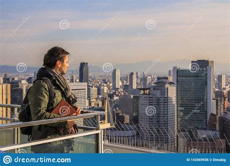 european tourists shooting panoramic view   city  phone editorial photo image