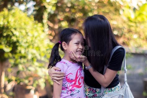 a daughter kissing her mother stock image image of cute