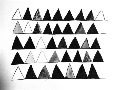 black  white triangles  arranged   shape