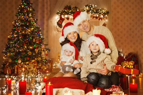 christmas family portrait  home holiday room  santa hat stock