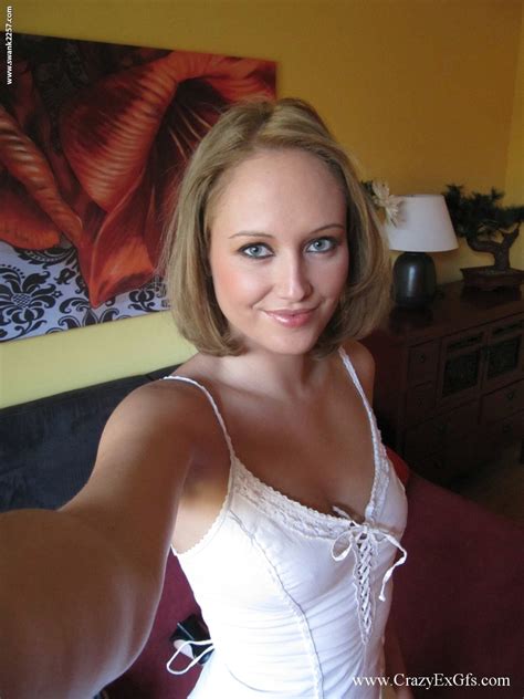 Amateur Blonde Takes Self Shots Of Her Tan Lined Breasts