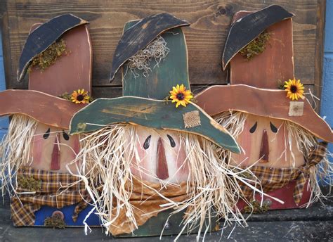 olde country cupboard  wood scarecrow heads