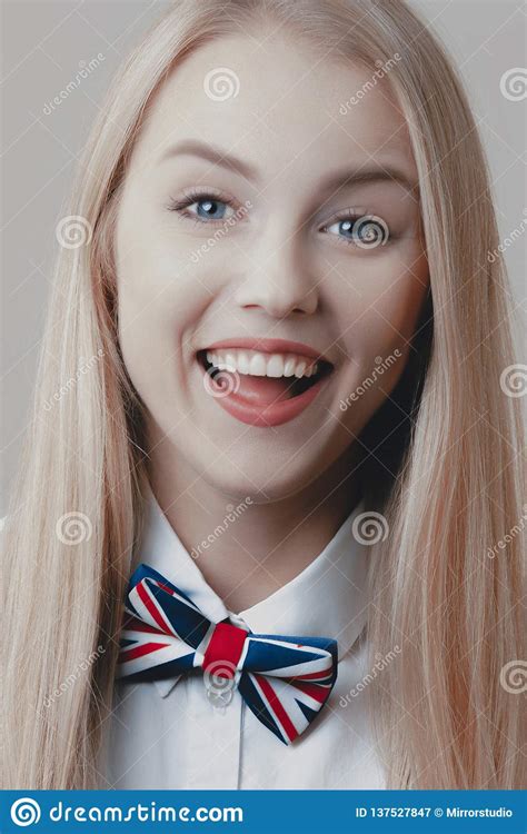 Young Playful Cute Blonde With Bow Tie Is Laughing Stock Image Image