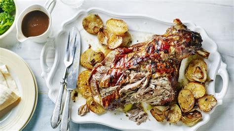 slow roast shoulder of lamb with sliced potatoes recipe bbc food