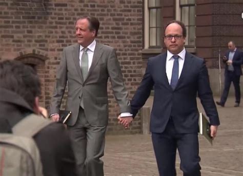 dutch lawmakers hold hands to show solidarity for gay