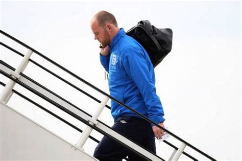 wayne rooney jets out with england squad despite