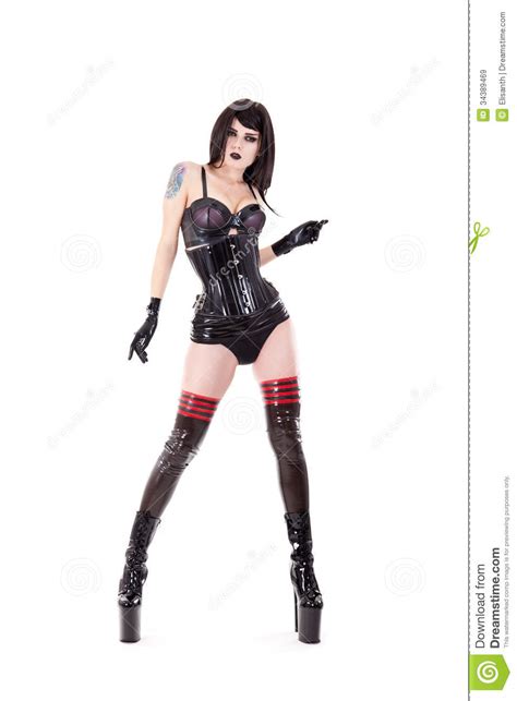dominatrix in latex outfit and high heels stock image