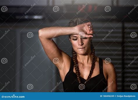 Young Sweaty Strong Muscular Fit Girl Hands Holding Heavy Kettlebell On