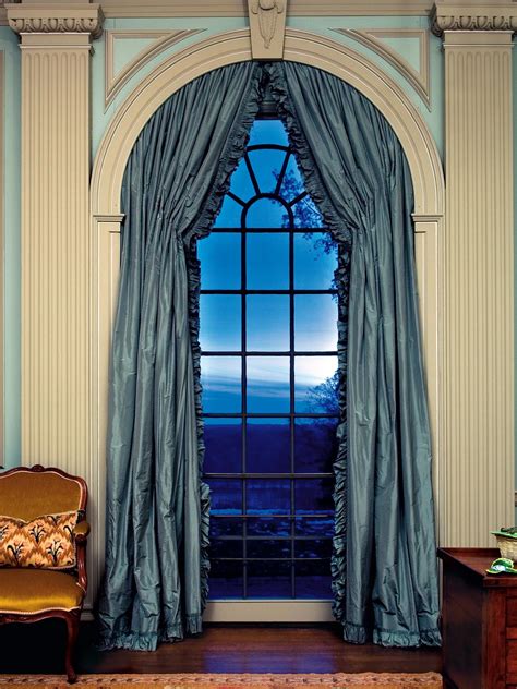 white  blue arched window  columns hgtv