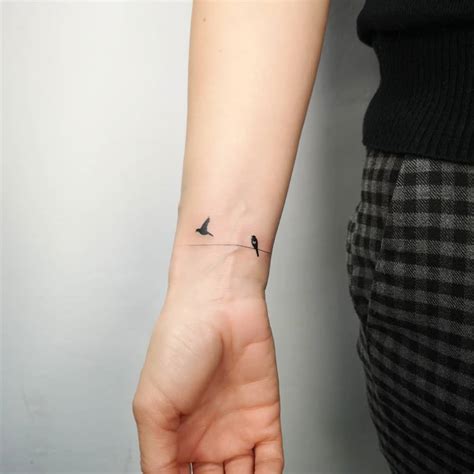 tiny birds  wrist tattoo  michal sukiennik