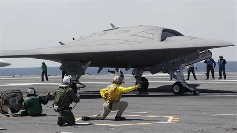 unmanned navy jet lands  aircraft carrier vermont public radio