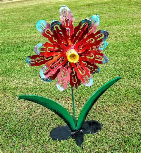 handmade metal flower outdoor garden sculpture  raymond guest