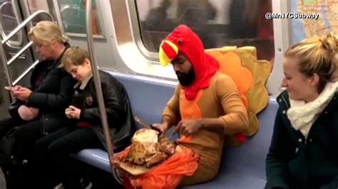 watch man in turkey costume gobbles down turkey on subway