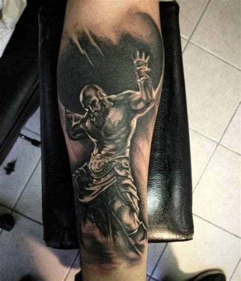 big black and white titan like tattoo on arm tattooimages