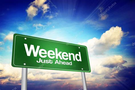 weekend   green road sign business concep stock photo