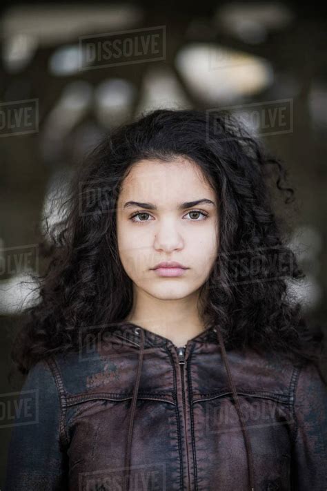 Portrait Of Confident Teenage Girl With Curly Black Hair