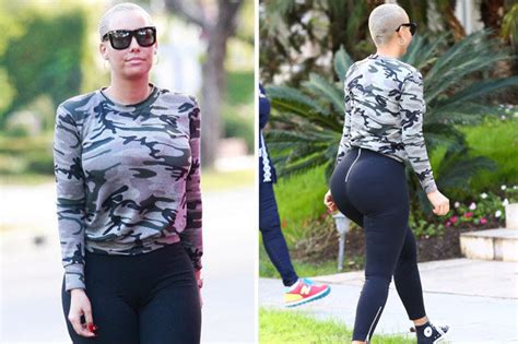 amber rose hoists up leggings to show off her enormous bum