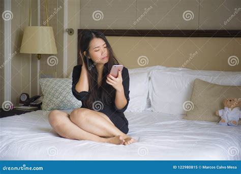 Lifestyle Portrait Of Young Happy And Relaxed Asian Chinese Woman At