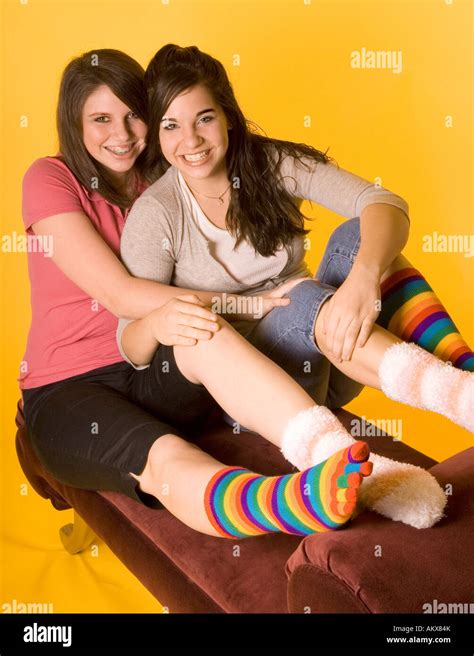 Two Teen Girls 15 17 Wearing Colorful Mismatched Socks Smiling Usa