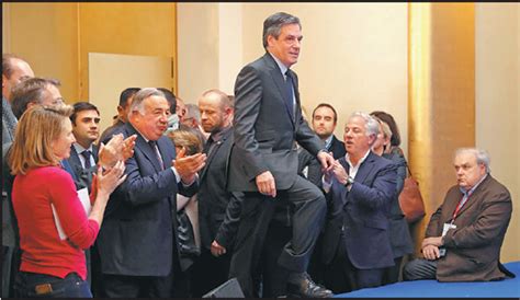 francois fillon walks to deliver a speech after winning
