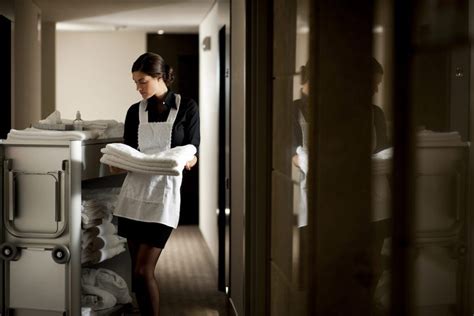Hotel Maid With Cart Refilling A Room Read What To Do When Staying A