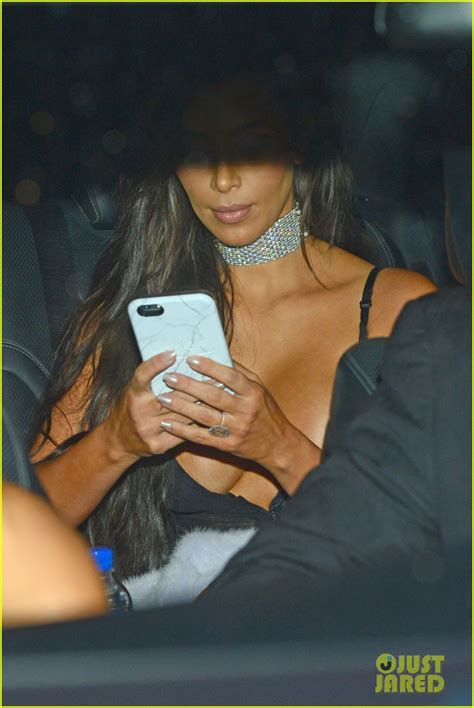 kim kardashian shows off major cleavage in sexy sheer dress for kanye