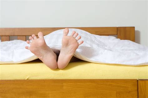 feet sticking out from blanket stock image image of unrecognisable blanket 7638561