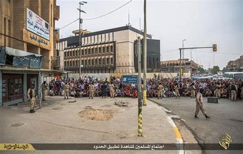 twisted isis executioner dangles gay man by his ankles before dropping him 100ft to crowd below