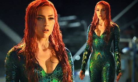 amber heard flaunts cleavage in costume as mera in aquaman daily mail online