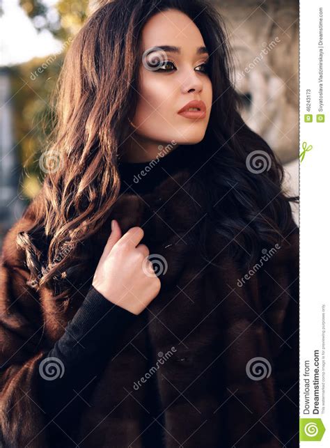 portrait of beautiful woman with dark hair in luxurious