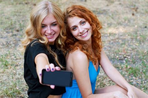 Two Girlfriends Taking A Selfie Stock Image Image Of Friends Park